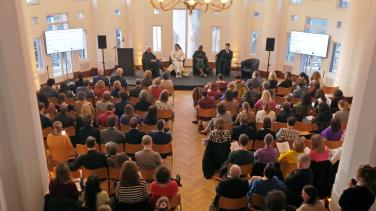 An overhead crowd shot of a meeting at Bozar Arts Centre