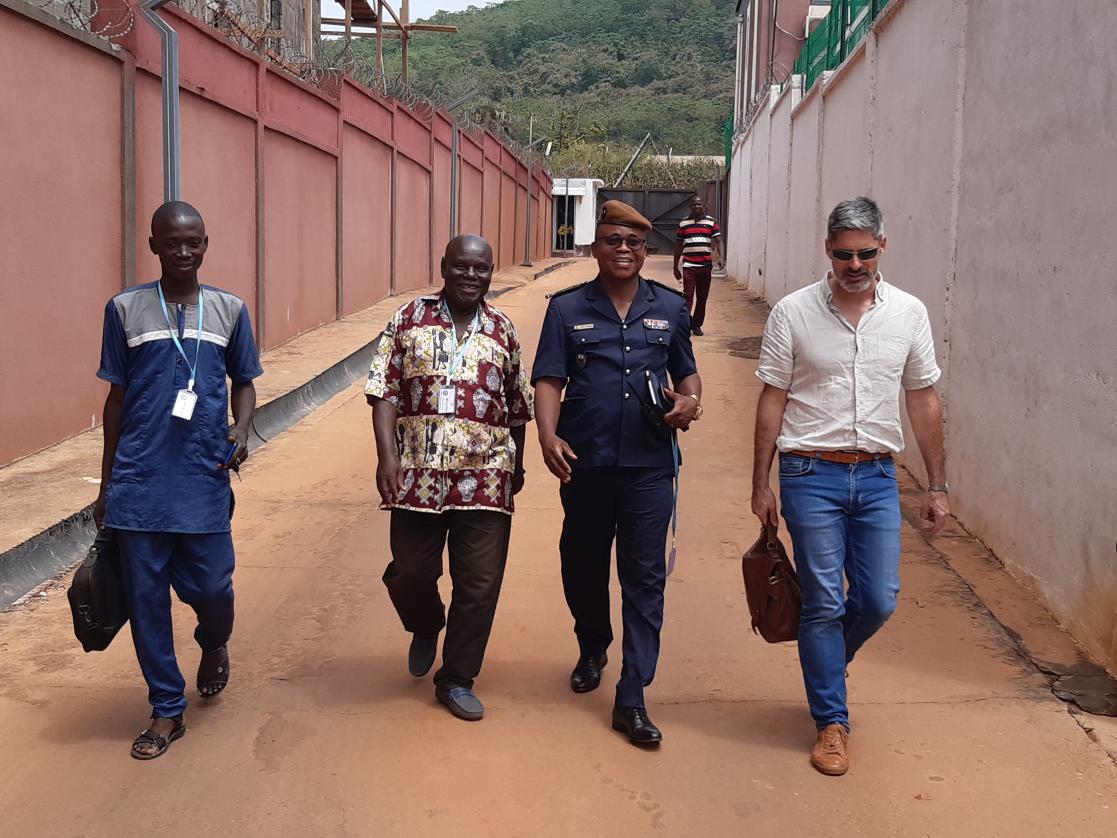 Group of four men walking