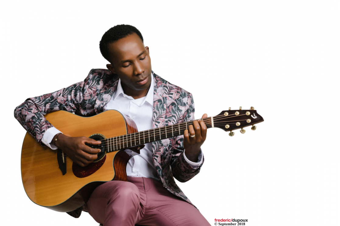 a man playing the guitar