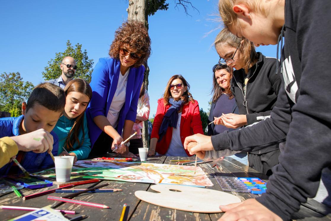EU Ambassador with children painting