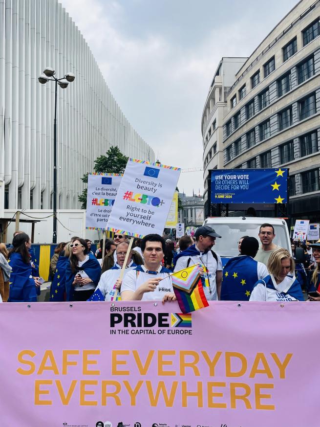 People with banners at Pride parade
