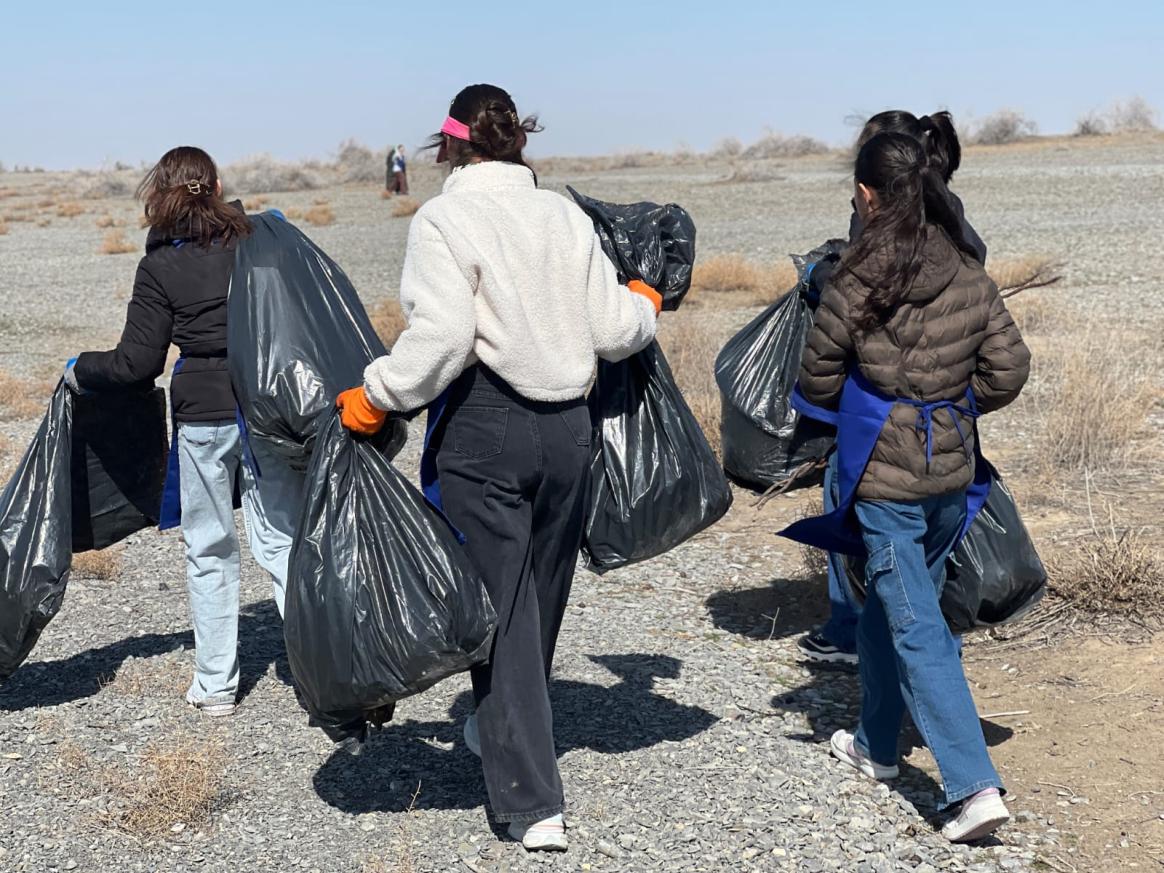 Volunteers team collecting waste