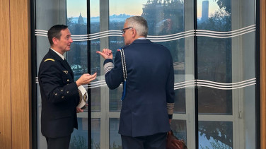 Two people in uniform talking to each other
