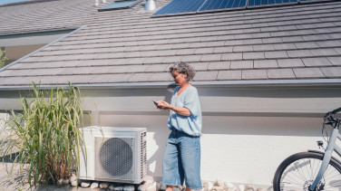 Woman standing in front of a house