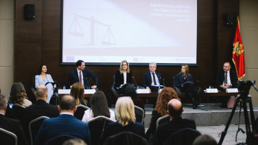 Officials sitting on stage
