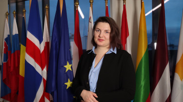 Weronika in front of flags