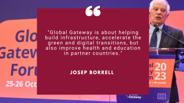 HR/VP Josep Borrell talking at the Global Gateway Forum 2023, HR/VP stands in front of the lectern, in the background a banner with written global Gateway Forum 2023, 25-26 October with pink and purple tones.