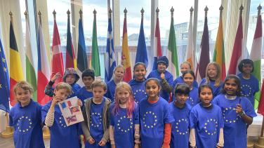 photo of happy children wearing EU T-shirts