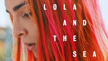 A young woman with red hair looks down with the words "Lola and the Sea" over top