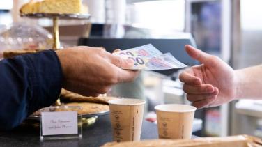 Inflation - money changing hands over coffee counter