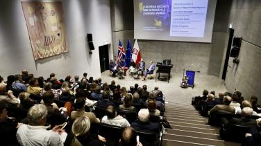 a picture of an auditorium full of guests. 