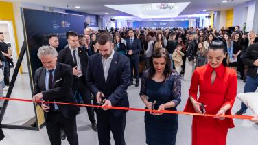 Ambassador, Prime Minister, Minister of Education, and School Director cutting ribbon
