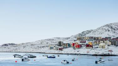 Greenland - frozen sea with residential buildings