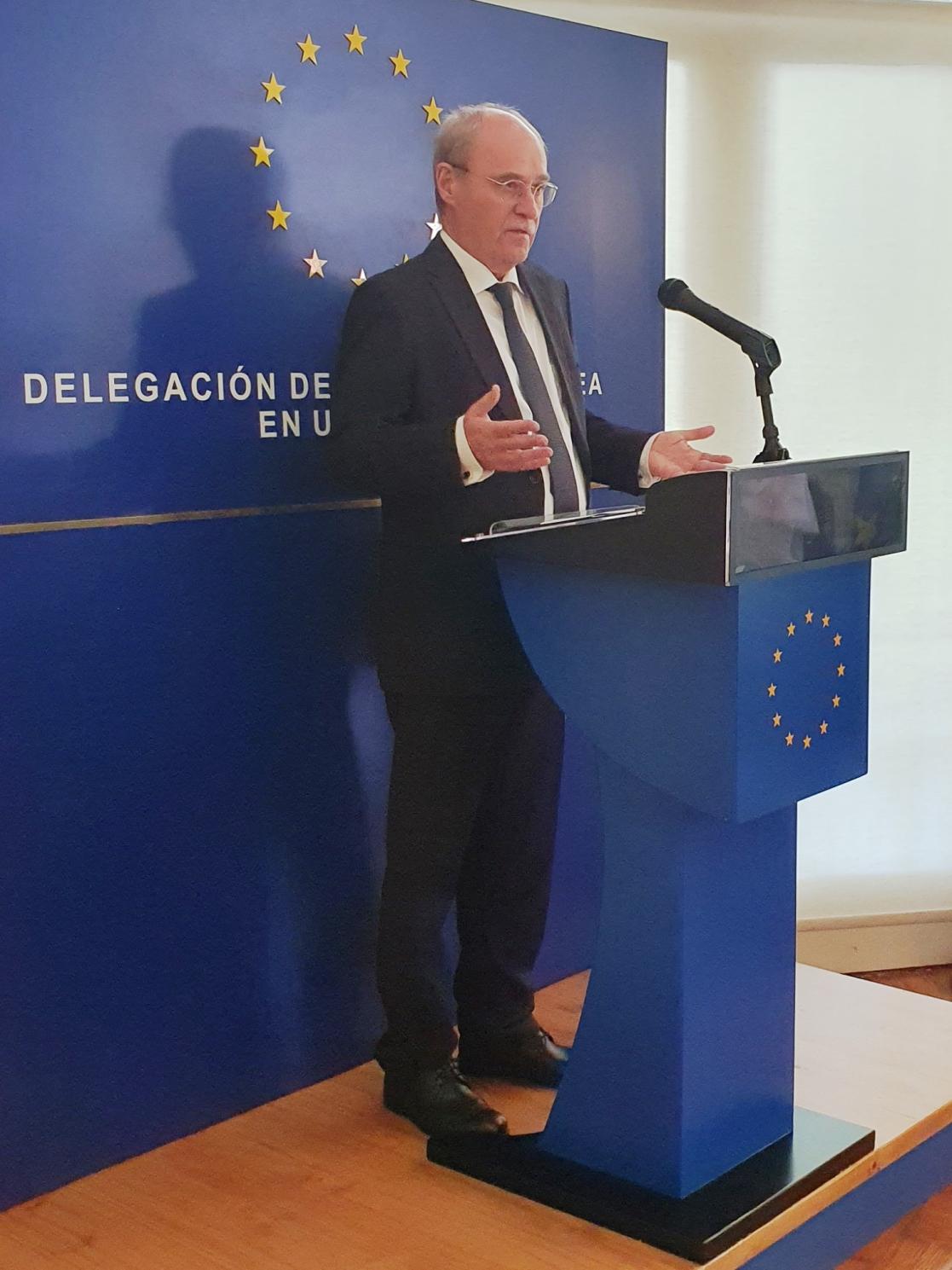 Man talking into a lectern