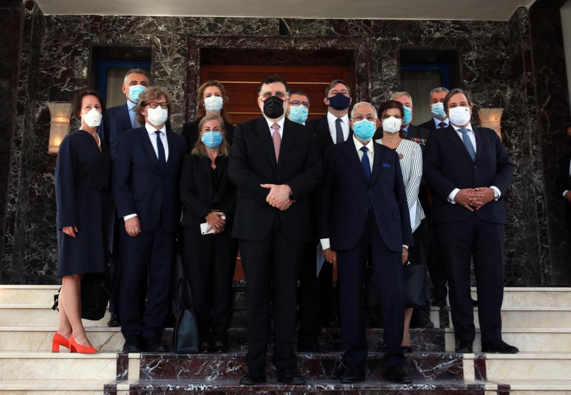 Group of people posing on a staircase