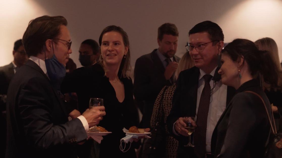Group of people talking a reception