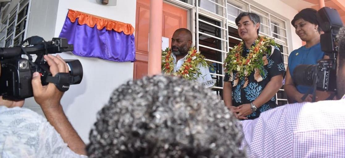 Group of people talking to several cameras