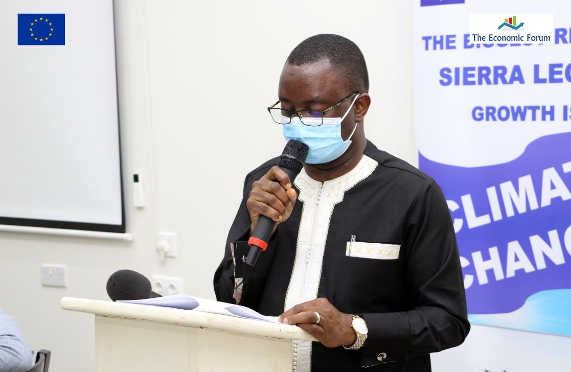 Man talking into a lectern