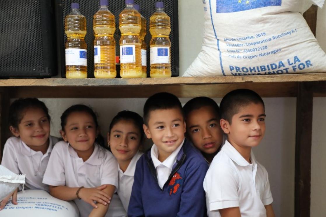 Group of kids under a table