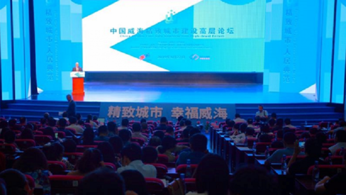 Man talking into a lectern during an event