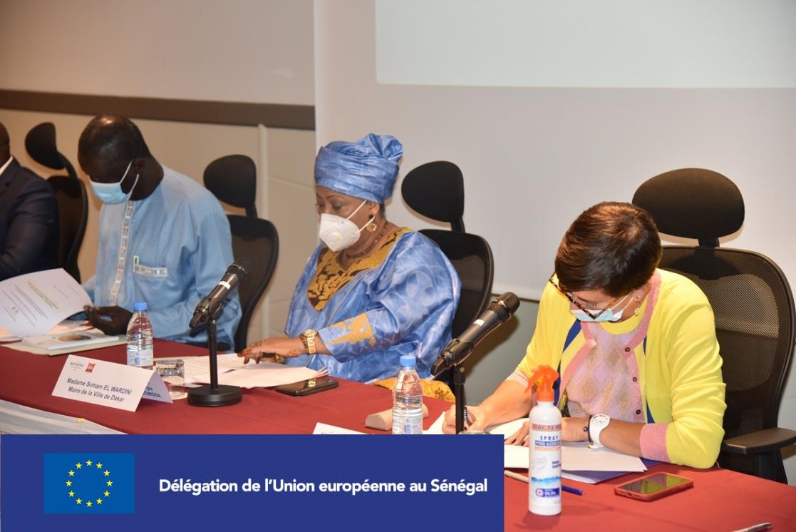 Woman writting during a conference