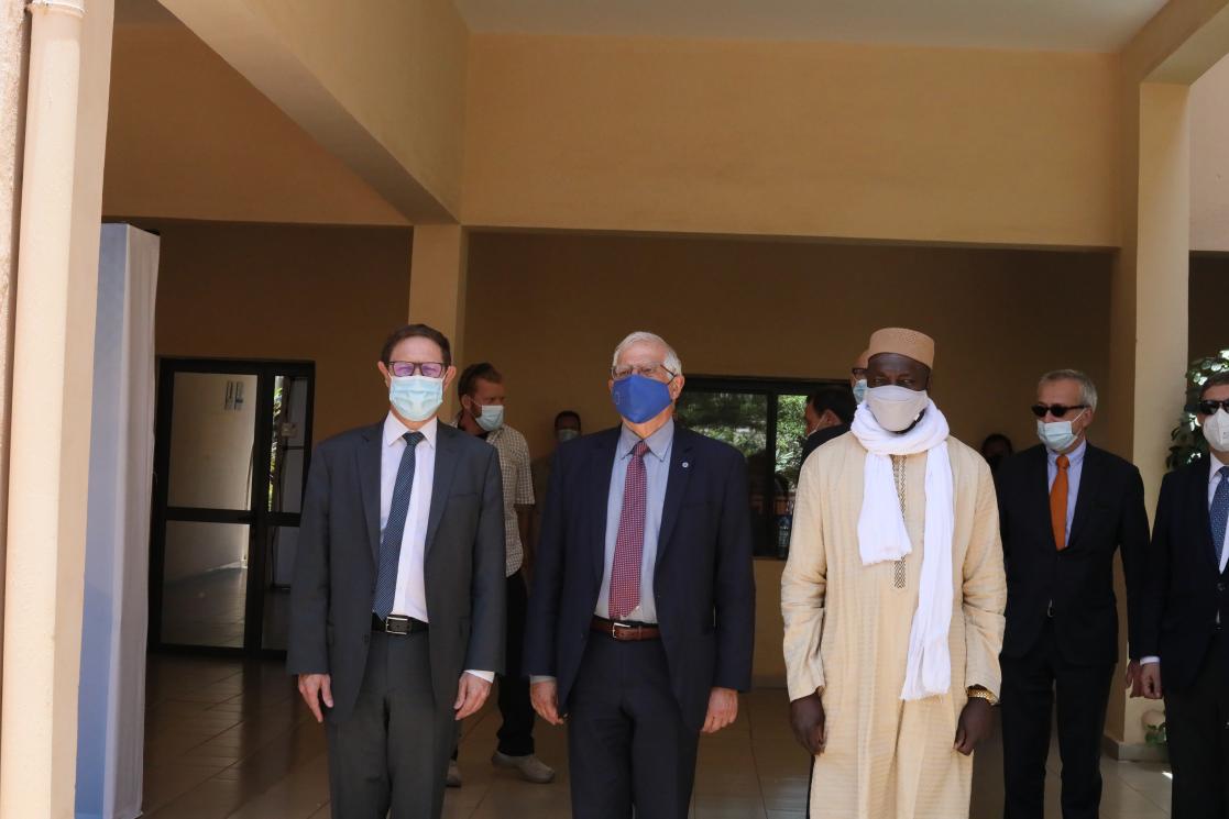 Three man on formal clothes looking at the camera