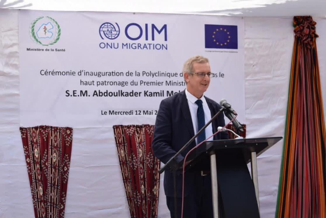 Man giving a speech on a stand