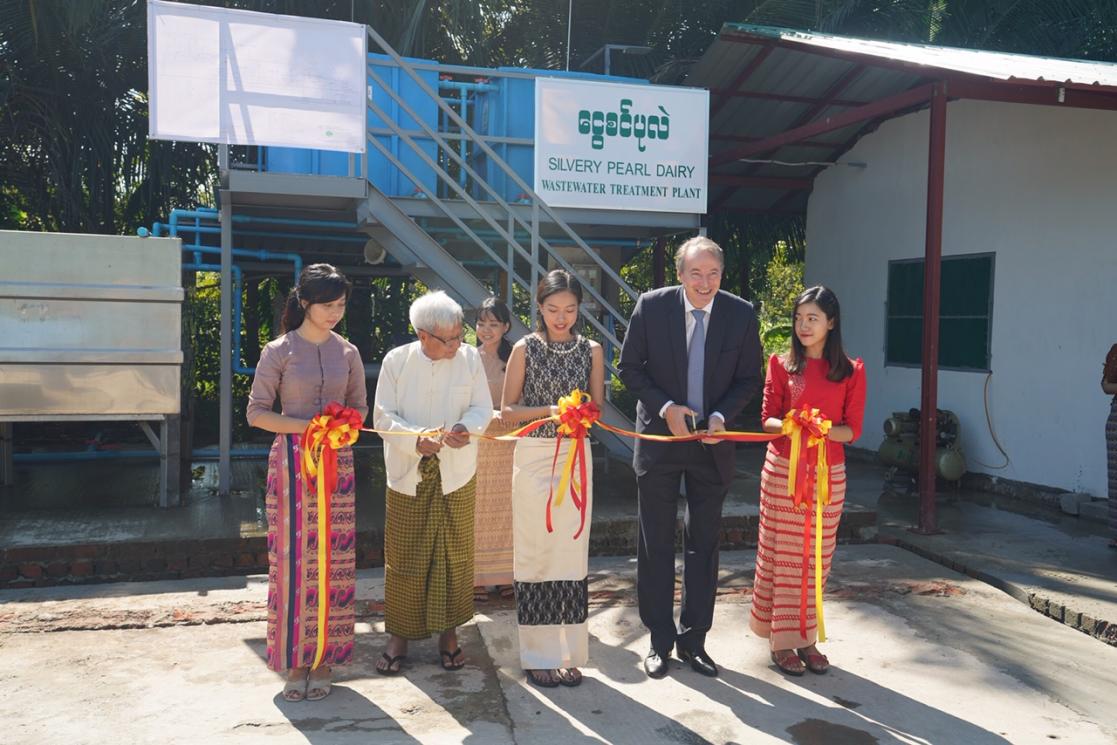 People cutting a ribbon