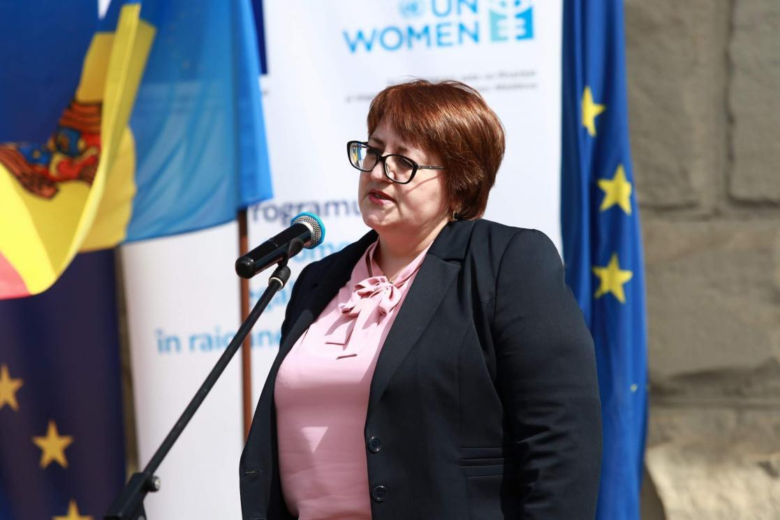 Woman talking into a microphone