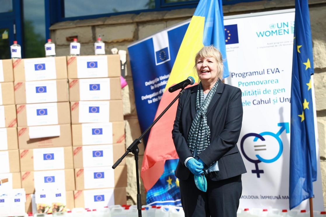 Woman talking into a microphone