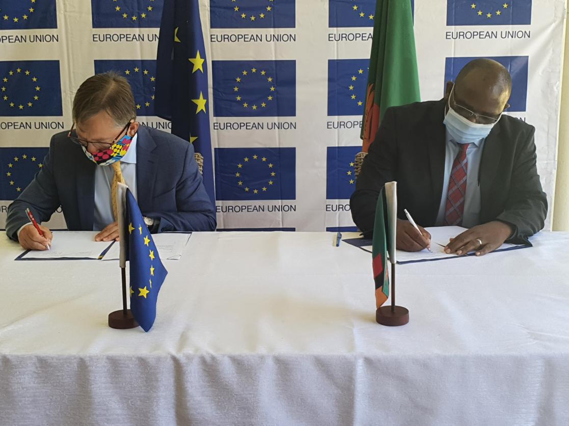 People signing documents