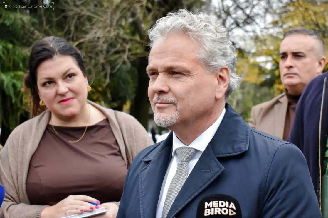 Ambassador Sattler standing and giving statement