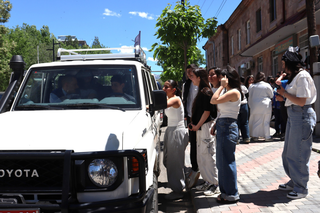 Young people getting to know EUMA vehicle and equipment.