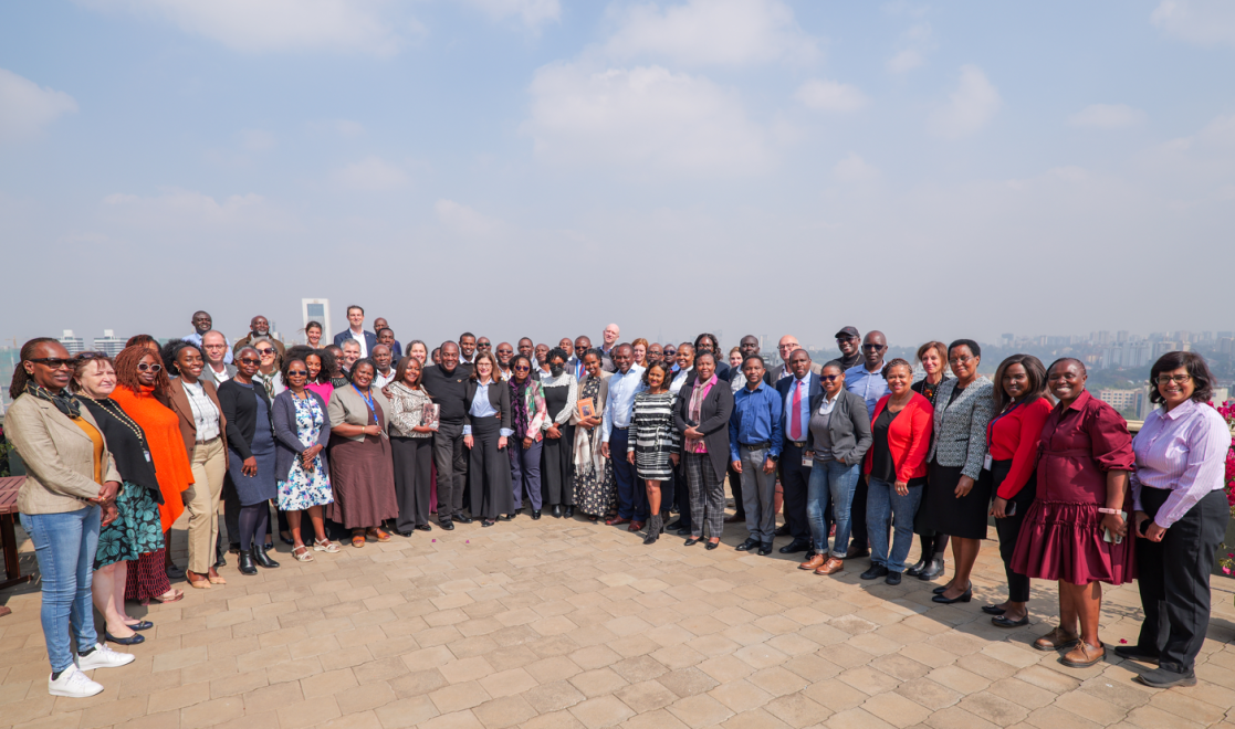 Delegation staff pose with journalist Jeff Koinange