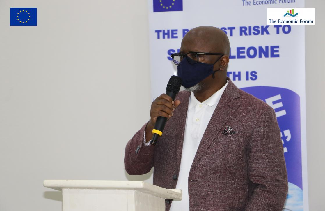 Man talking into a lectern