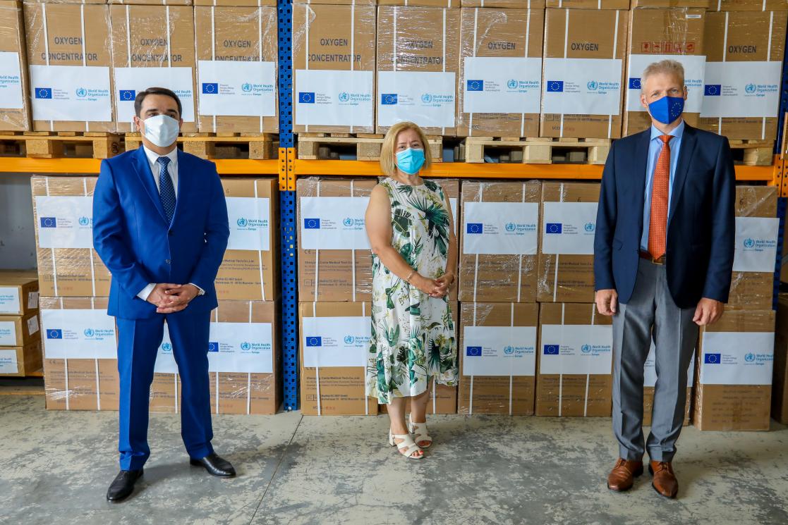 Two man and a woman in a Manufactures office