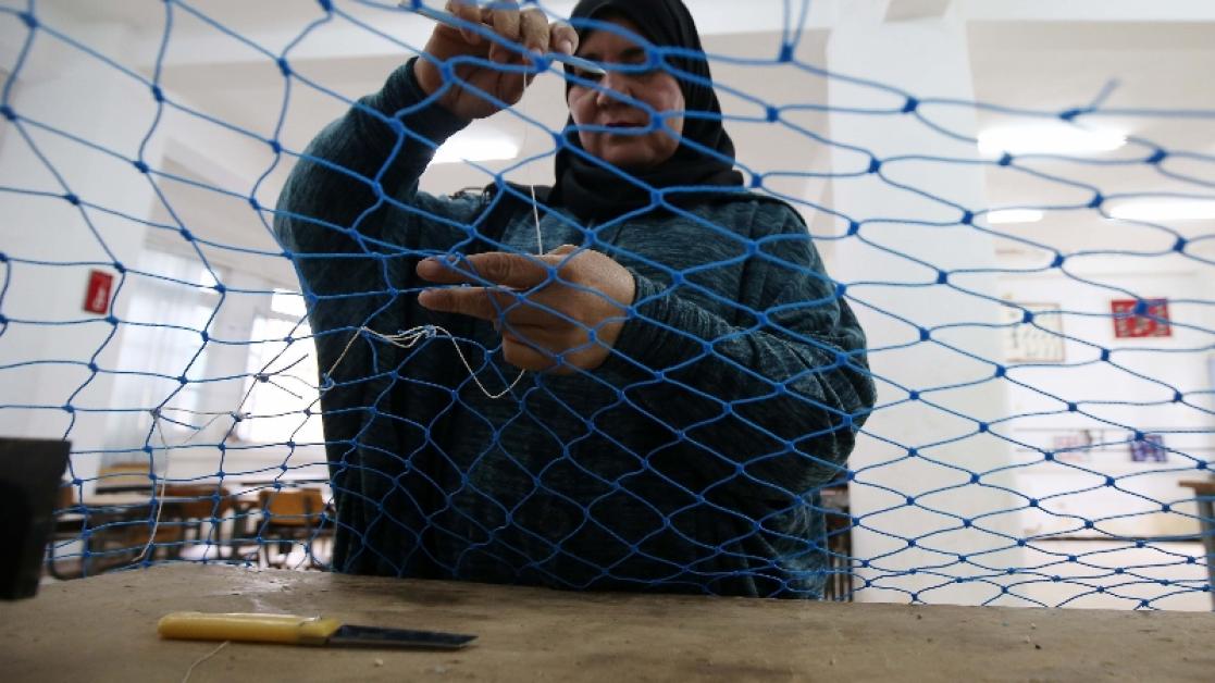 a woman working with her hands 