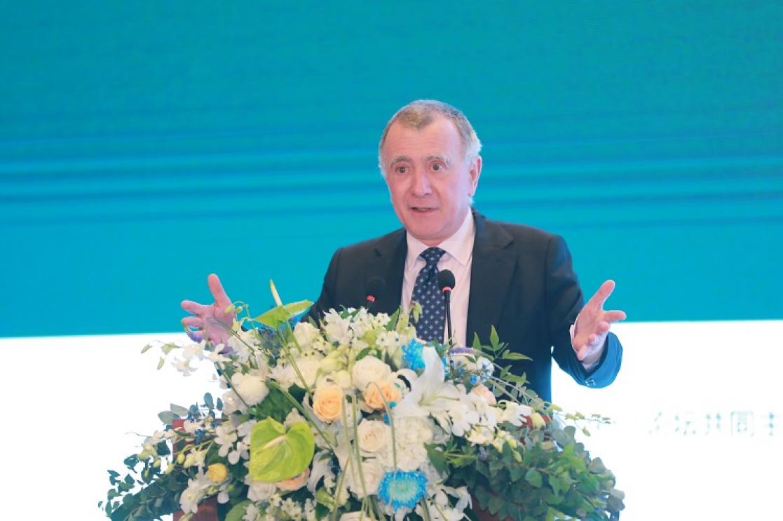 Man talking into a lectern