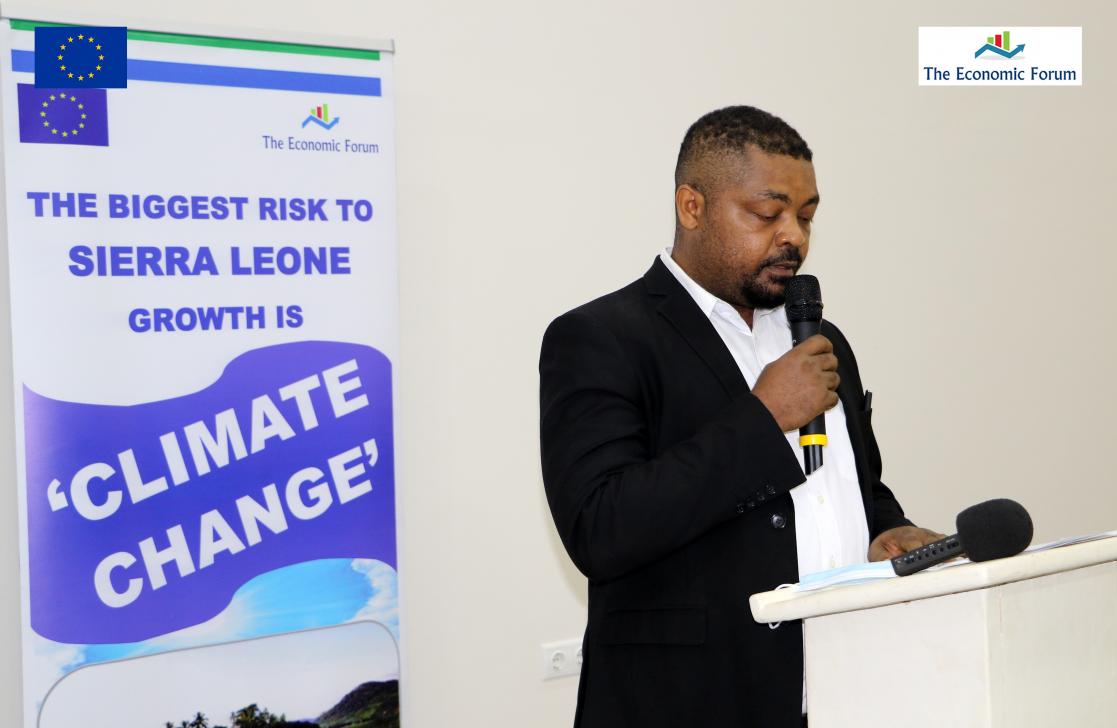 Man talking into a lectern
