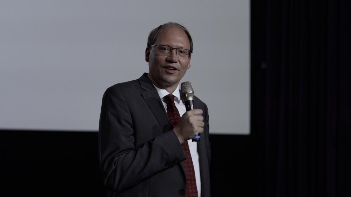 Man speaking into a microphone