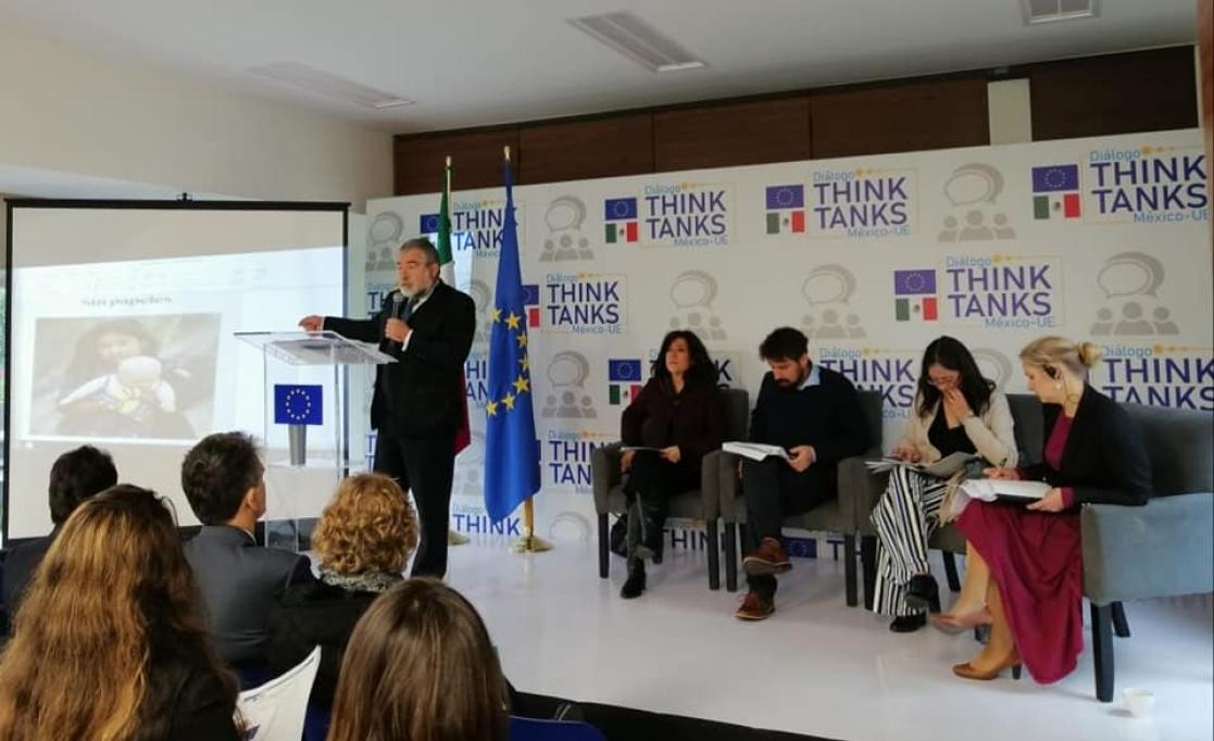 Man talking into a lectern during an event