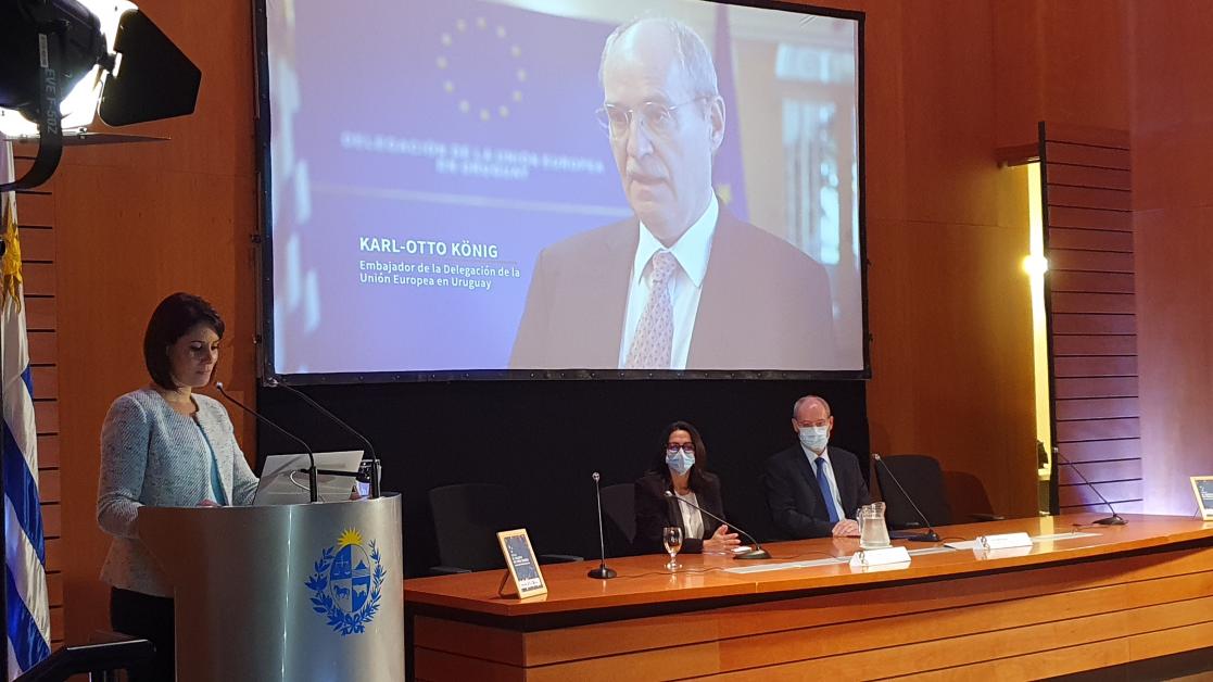 Woman giving a speech on a conference