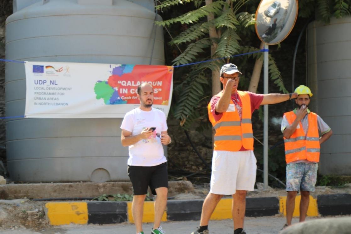 three mens with reflect jackets giving instructions 