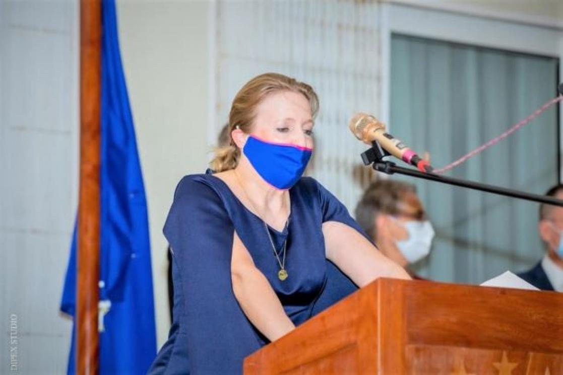 Woman giving a speech on a stand