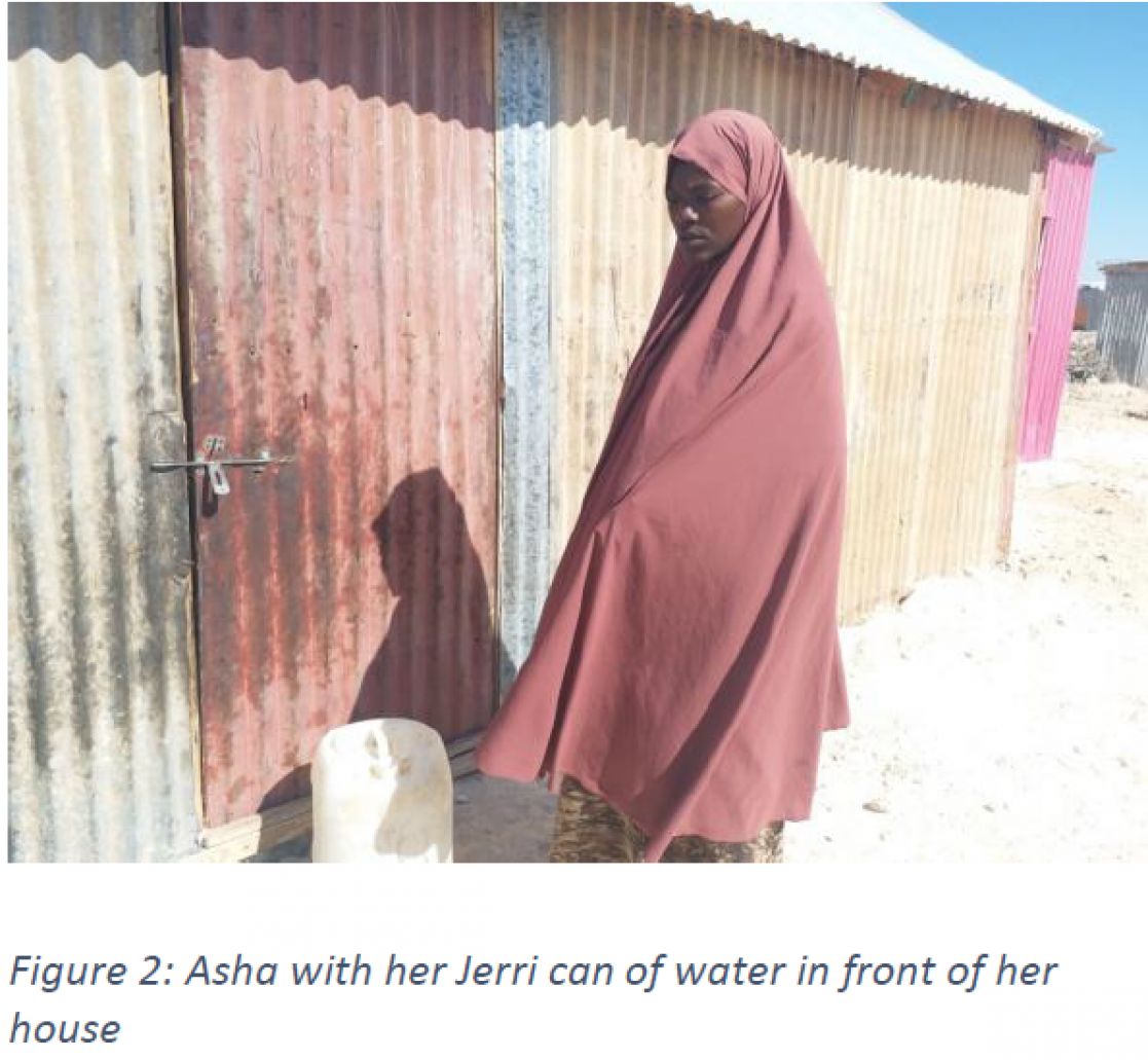 person with a can of water in front of her house