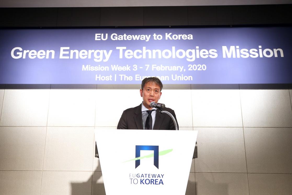 Man talking into a lectern