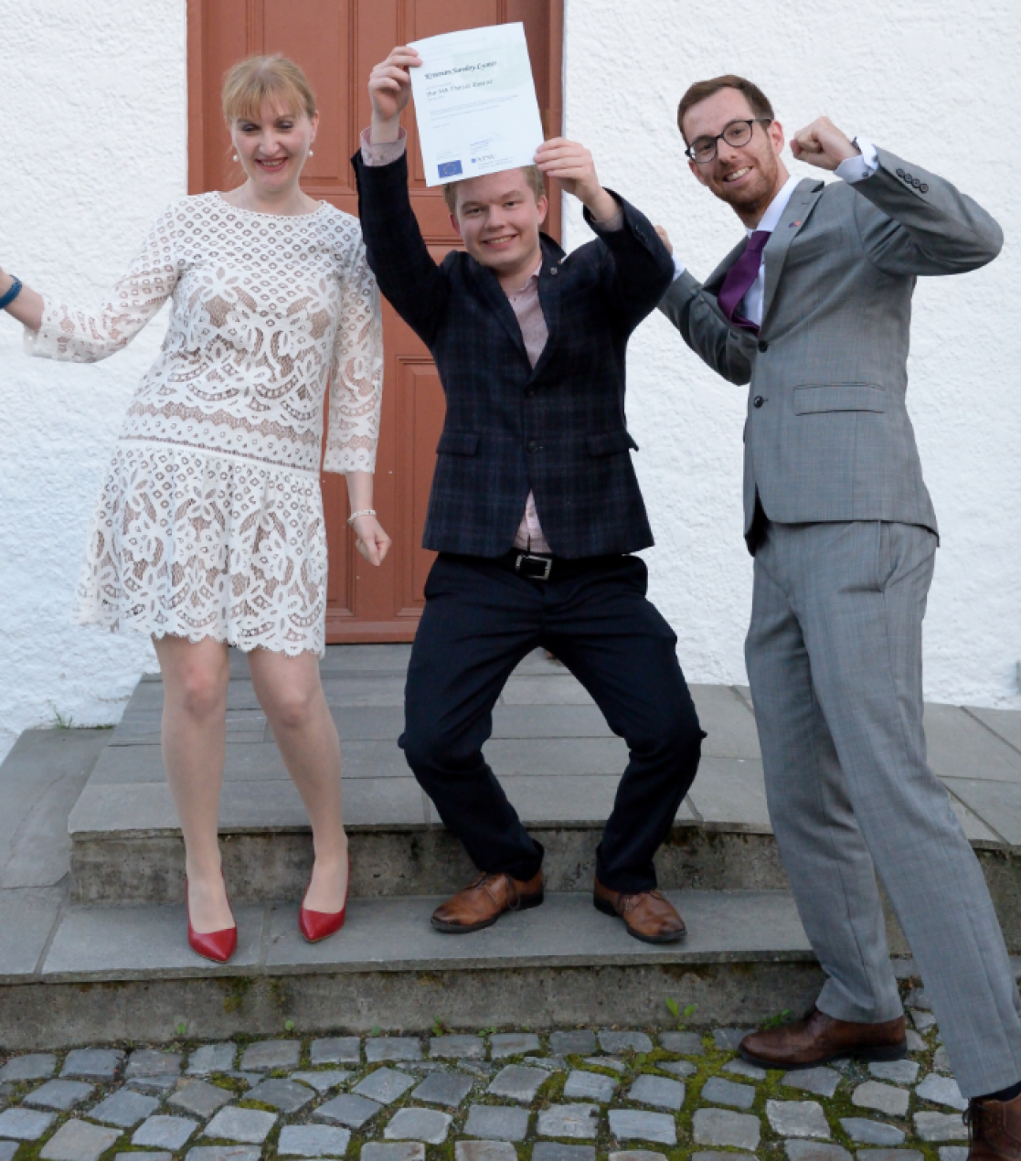 People posing and showing an achievement