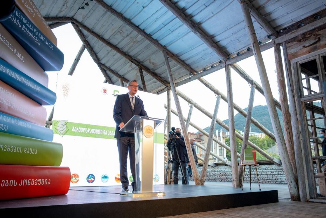 Man talking into a lectern