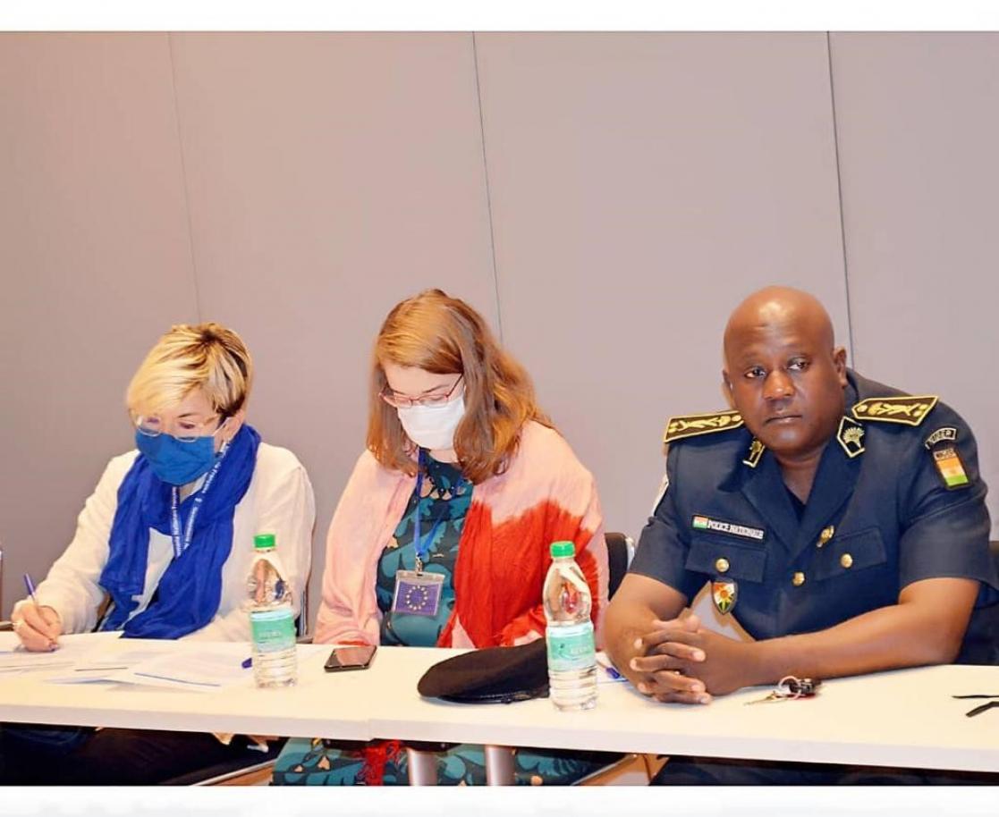 Two women and a man during a presentation at a round table
