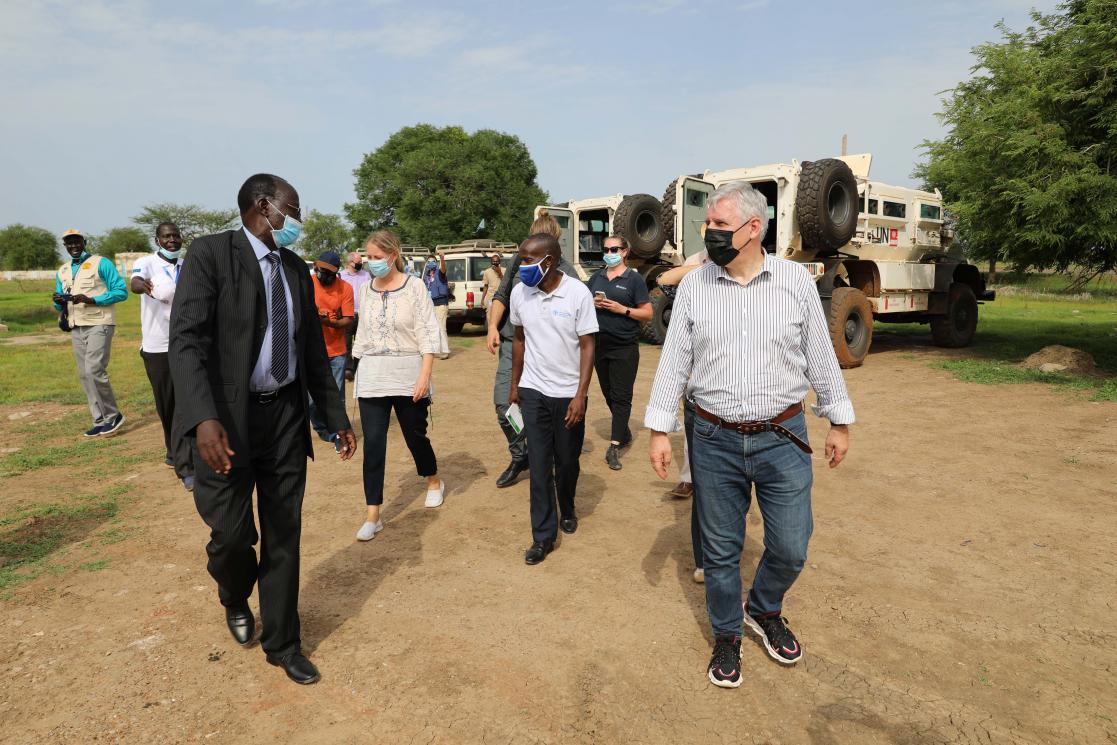Group of people talking while walking